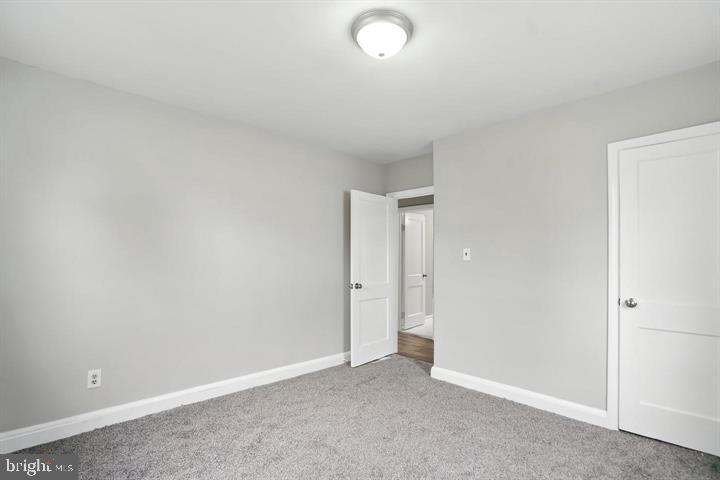 1239 Hilldale Road Baltimore, MD 21237 - Photo 9 of 13 an empty room with closet area