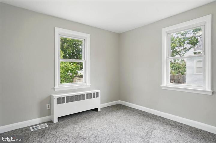 1239 Hilldale Road Baltimore, MD 21237 - Photo 10 of 13 an empty room with a window