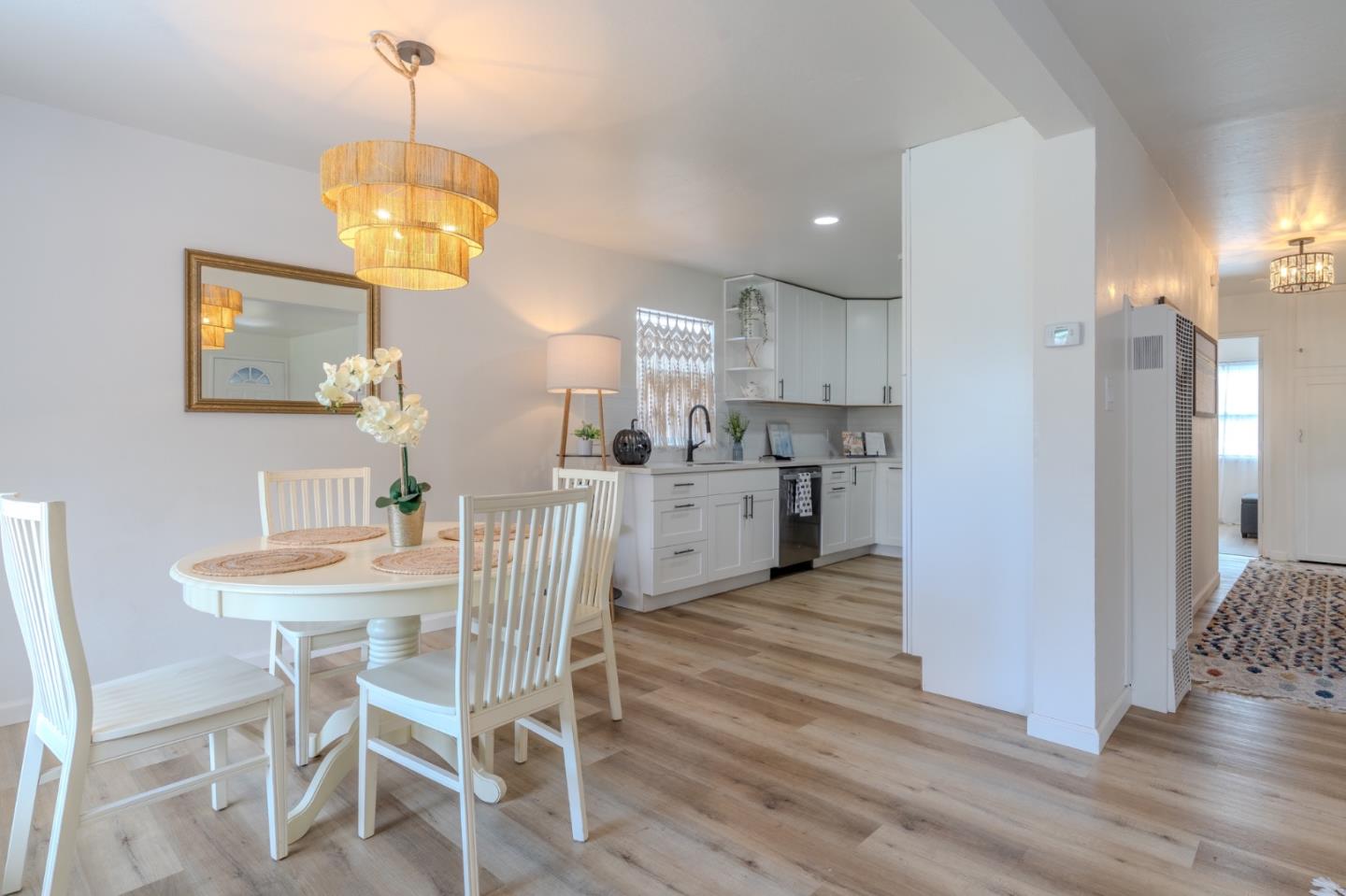 1324 Peralta Road Pacifica, CA 94044 - Photo 11 of 35 a view of a dining room and chandelier fan and wooden floor