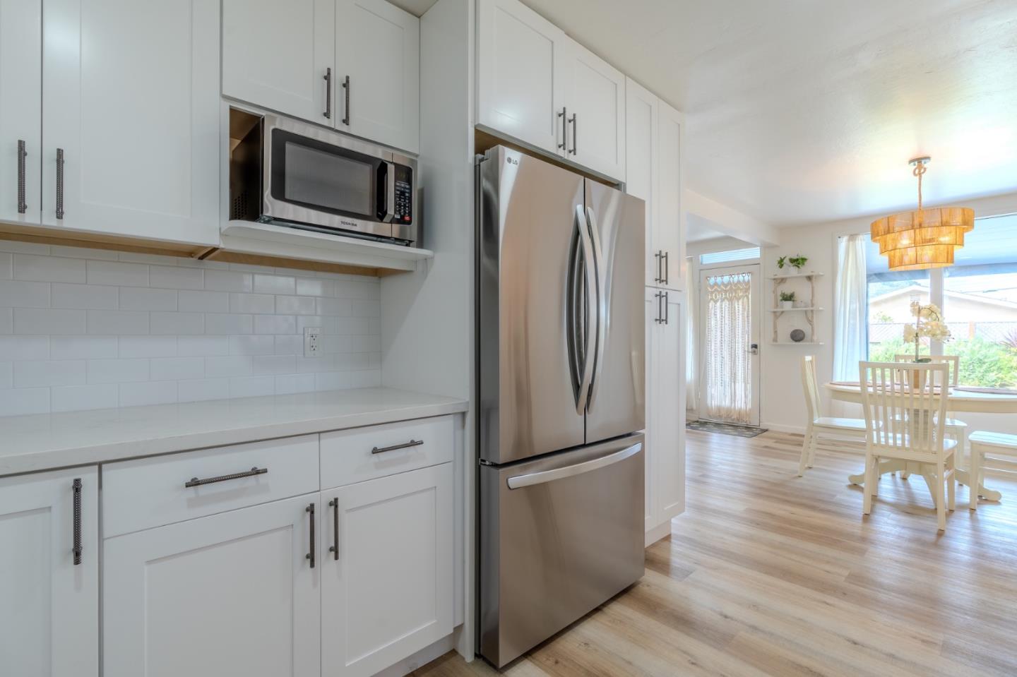 1324 Peralta Road Pacifica, CA 94044 - Photo 16 of 35 a kitchen with stainless steel appliances a refrigerator microwave and stove