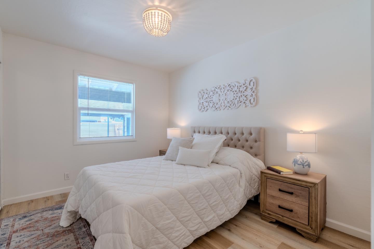 1324 Peralta Road Pacifica, CA 94044 - Photo 18 of 35 a bedroom with a bed and a window