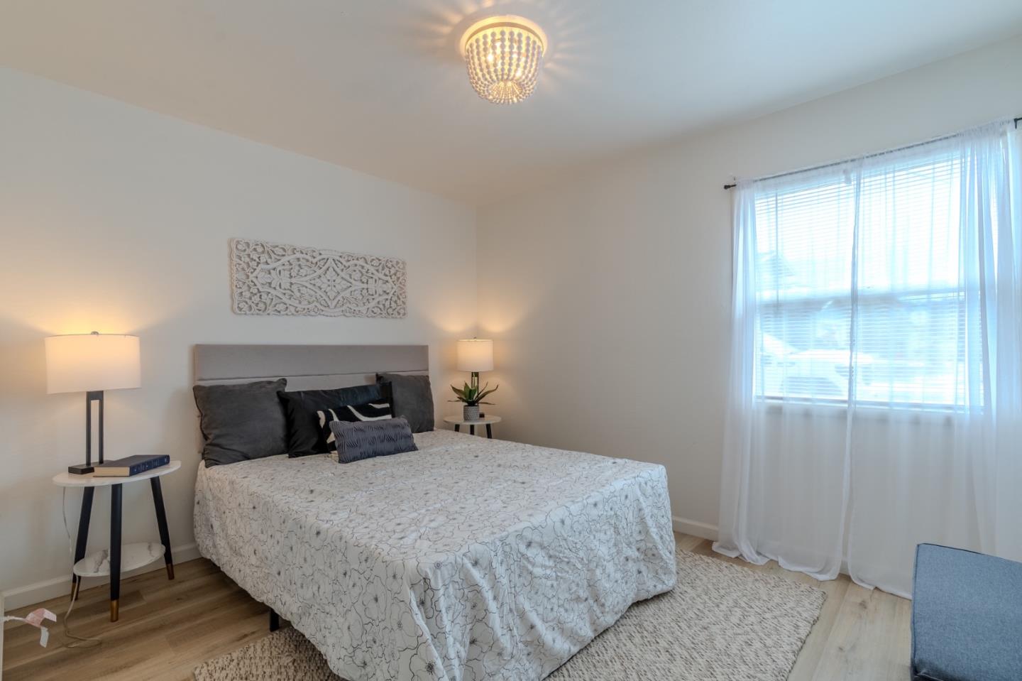 1324 Peralta Road Pacifica, CA 94044 - Photo 19 of 35 a bedroom with a bed and a window