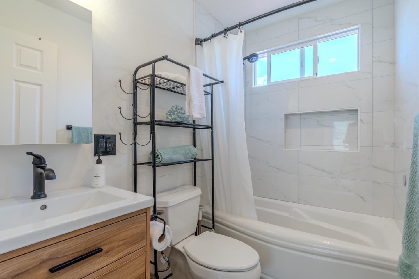 1324 Peralta Road Pacifica, CA 94044 - Photo 21 of 35 a bathroom with a sink toilet and shower