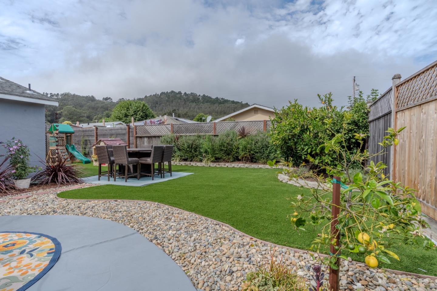 1324 Peralta Road Pacifica, CA 94044 - Photo 23 of 35 a view of a garden with lawn chairs