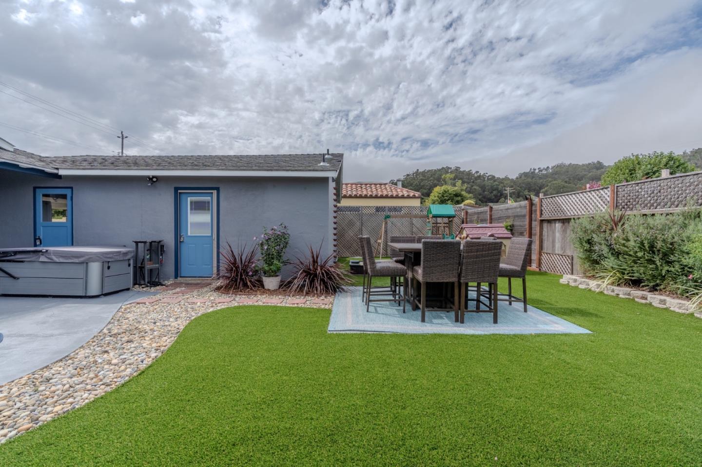 1324 Peralta Road Pacifica, CA 94044 - Photo 27 of 35 a view of a chair and table in backyard of the house