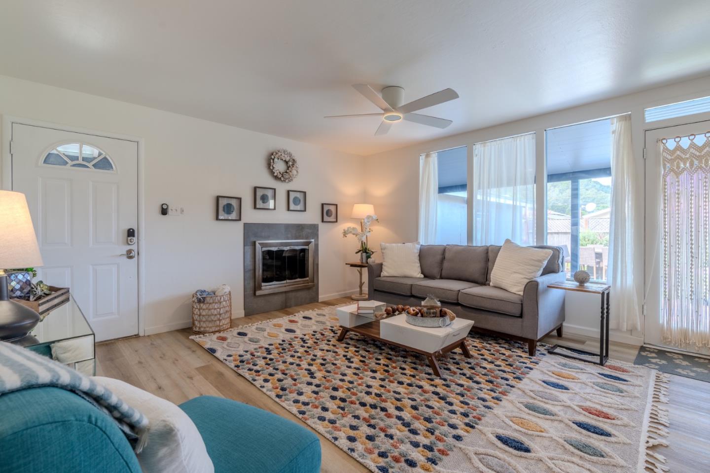 1324 Peralta Road Pacifica, CA 94044 - Photo 8 of 35 a living room with furniture a window and a fireplace
