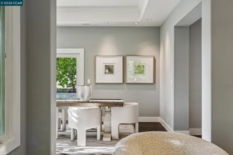 a dining room with furniture and window