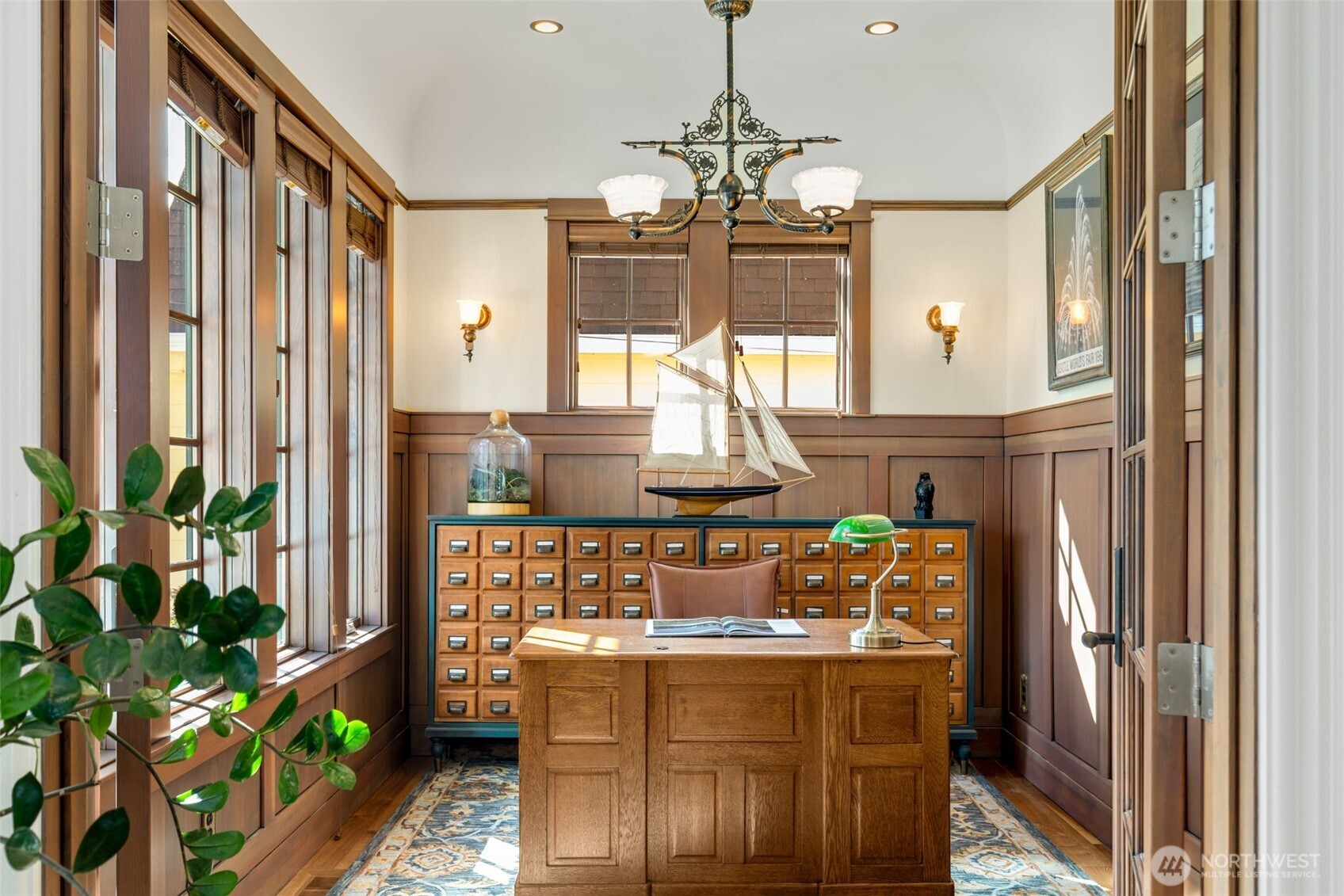 3723 41st Avenue Southwest Seattle, WA 98116 - Photo 11 of 40 a view of a dining room with furniture window and wooden floor