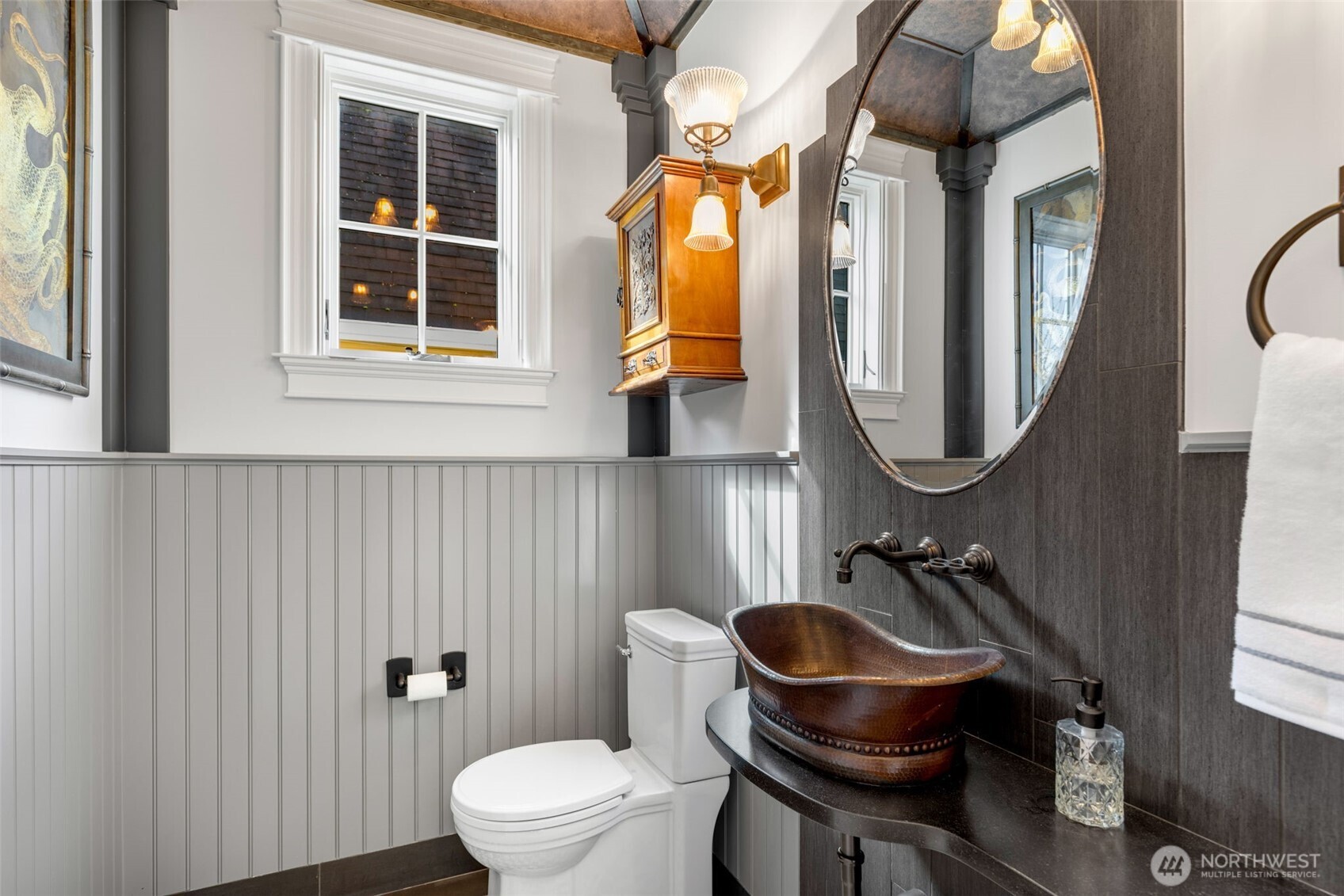 3723 41st Avenue Southwest Seattle, WA 98116 - Photo 15 of 40 a bathroom with a toilet a sink and mirror