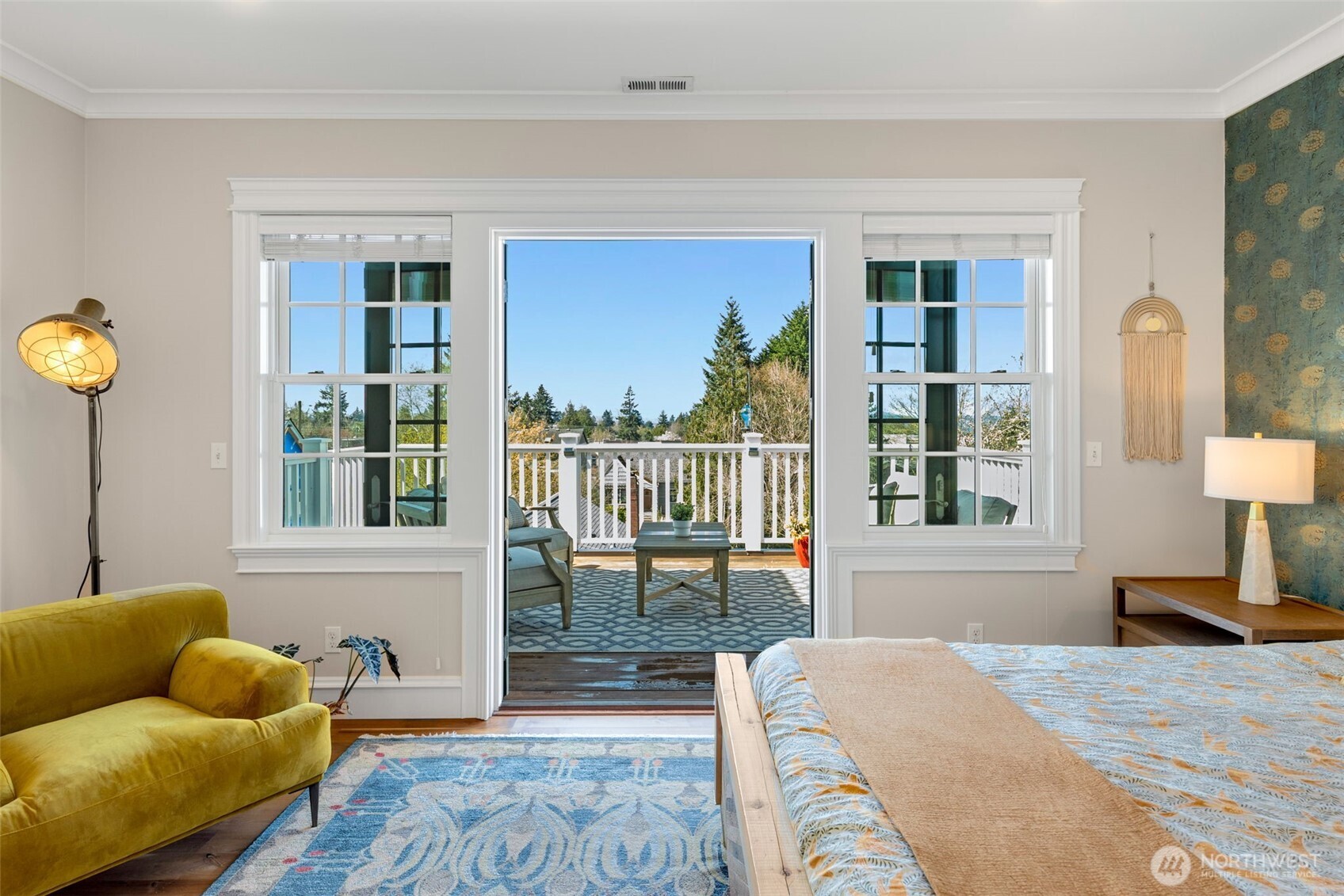 3723 41st Avenue Southwest Seattle, WA 98116 - Photo 17 of 40 a bedroom with a bed and glass window