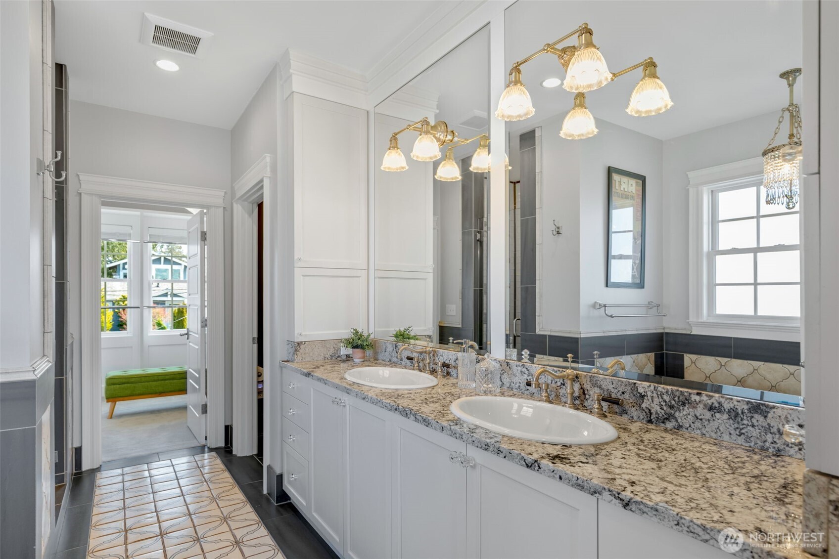 3723 41st Avenue Southwest Seattle, WA 98116 - Photo 21 of 40 a bathroom with a granite countertop sink a large mirror and a shower