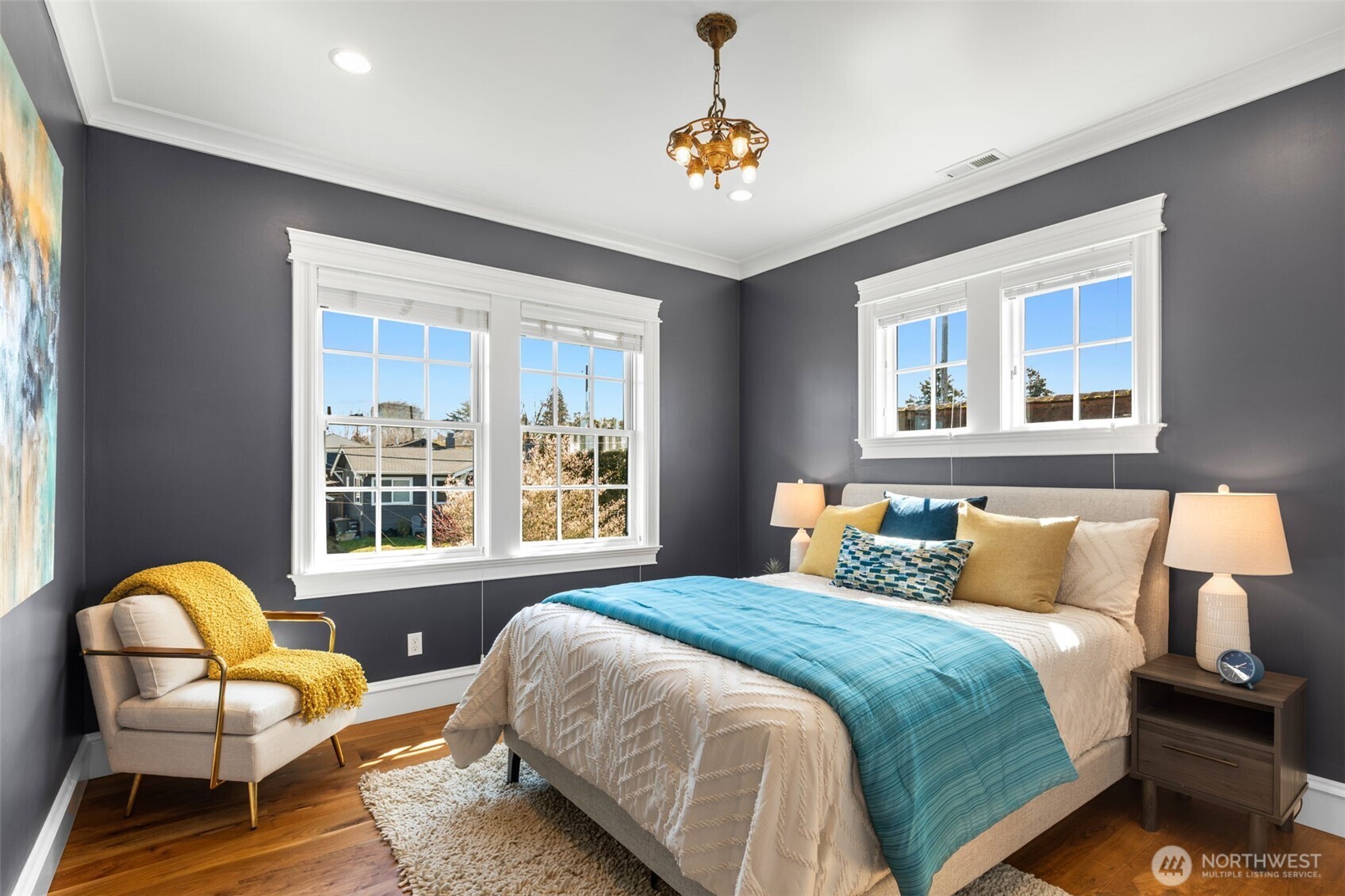 3723 41st Avenue Southwest Seattle, WA 98116 - Photo 24 of 40 a bedroom with a bed chair and balcony