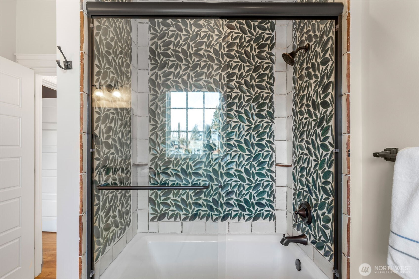 3723 41st Avenue Southwest Seattle, WA 98116 - Photo 26 of 40 a bathroom with a shower curtain and window