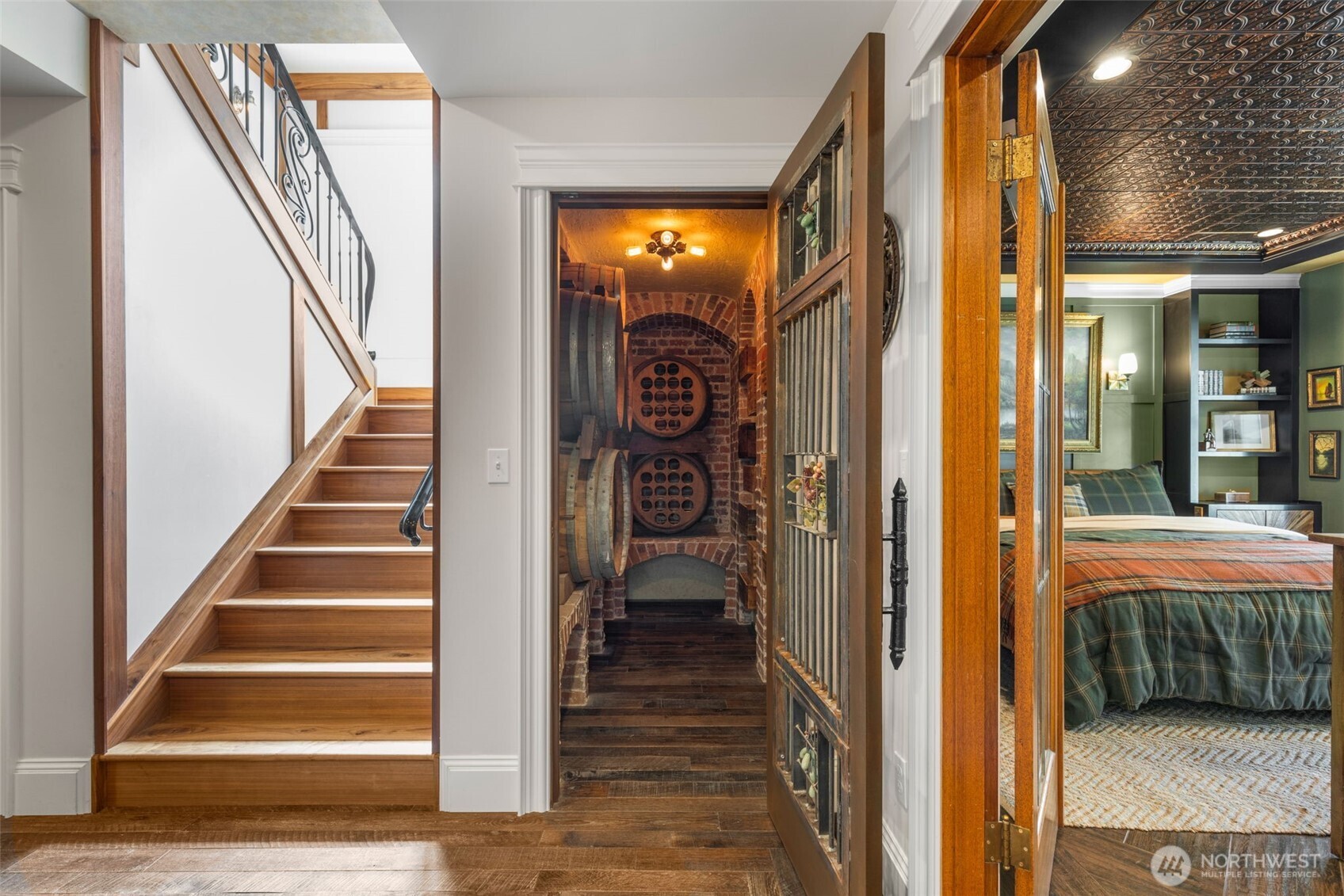 3723 41st Avenue Southwest Seattle, WA 98116 - Photo 28 of 40 a view of a hallway with wooden floor and stairs
