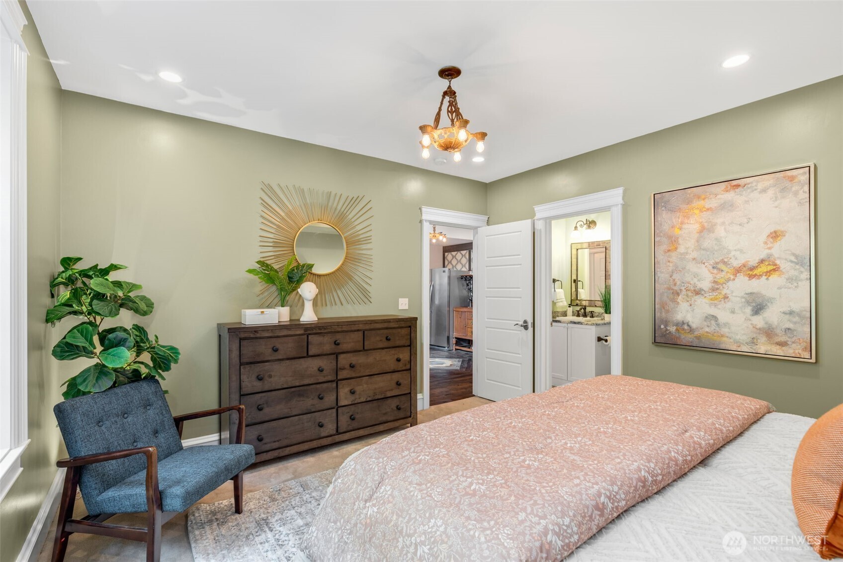 3723 41st Avenue Southwest Seattle, WA 98116 - Photo 34 of 40 a bedroom with a large bed and a chair