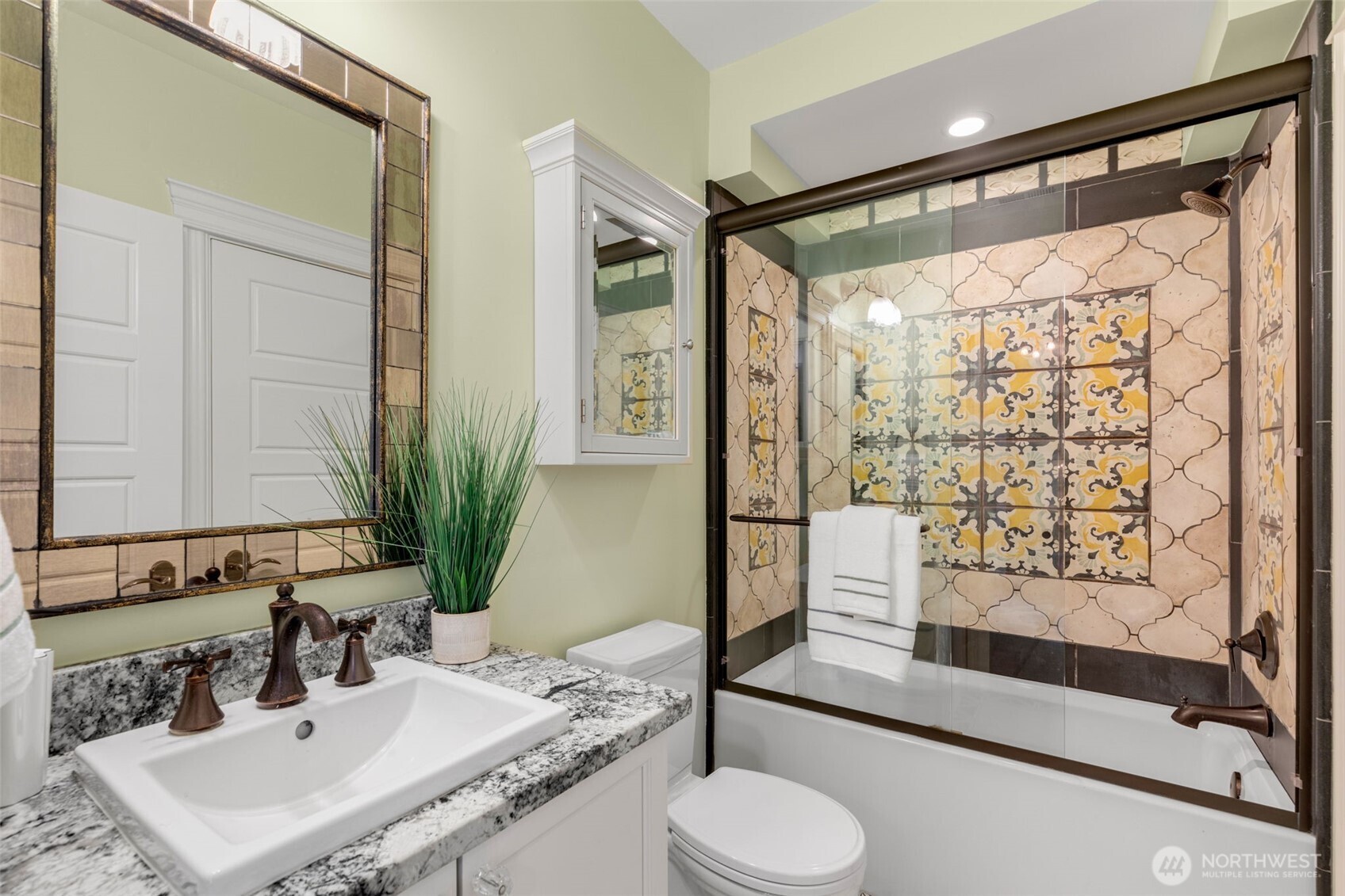 3723 41st Avenue Southwest Seattle, WA 98116 - Photo 35 of 40 a bathroom with a granite countertop sink toilet and shower