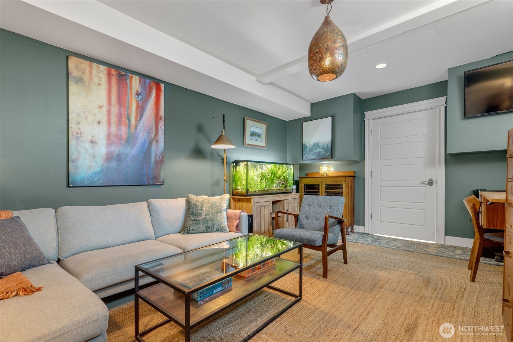 3723 41st Avenue Southwest Seattle, WA 98116 - Photo 36 of 40 a living room with furniture and a chandelier