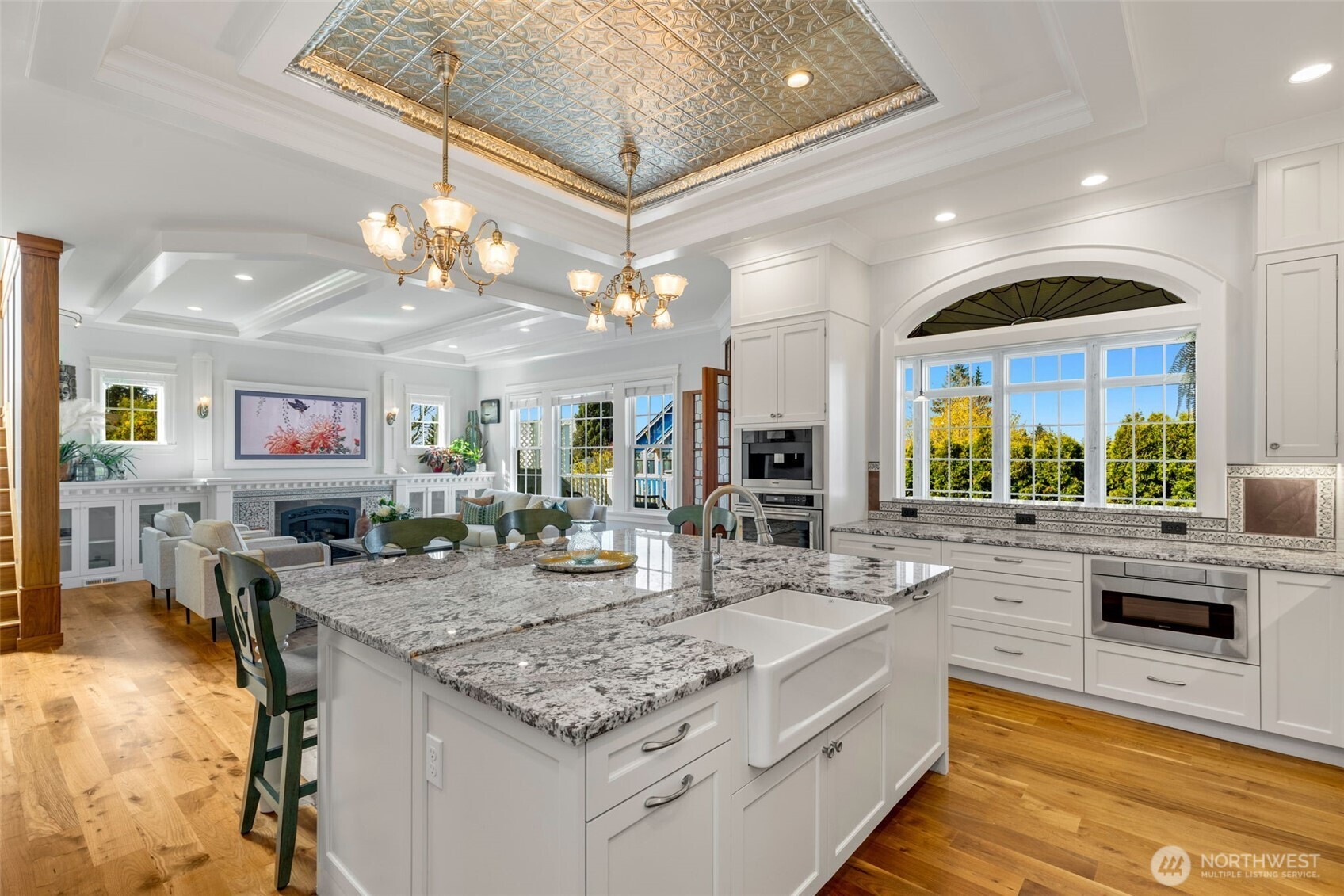 3723 41st Avenue Southwest Seattle, WA 98116 - Photo 7 of 40 a large kitchen with a counter space a sink and living room view