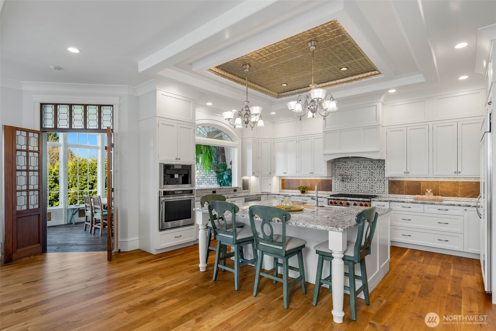 3723 41st Avenue Southwest Seattle, WA 98116 - Photo 8 of 40 a view of a dining room with furniture window and wooden floor