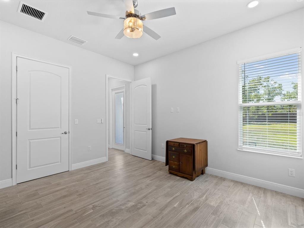 11981 Robina Road Weeki Wachee, FL 34614 - Photo 33 of 93 a view of an empty room with a window