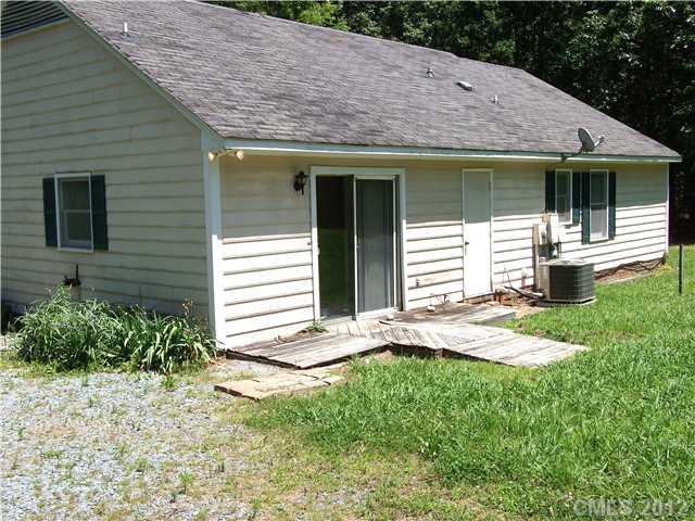1311 East Sandy Ridge Road Monroe, NC 28112 - Photo 13 of 13 a front view of a house with a yard and porch