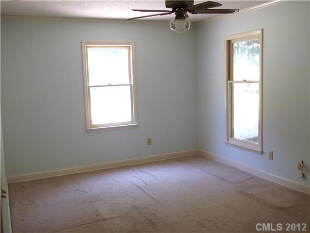 1311 East Sandy Ridge Road Monroe, NC 28112 - Photo 4 of 13 an empty room with a window