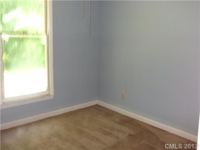 1311 East Sandy Ridge Road Monroe, NC 28112 - Photo 10 of 13 a view of an empty room and window