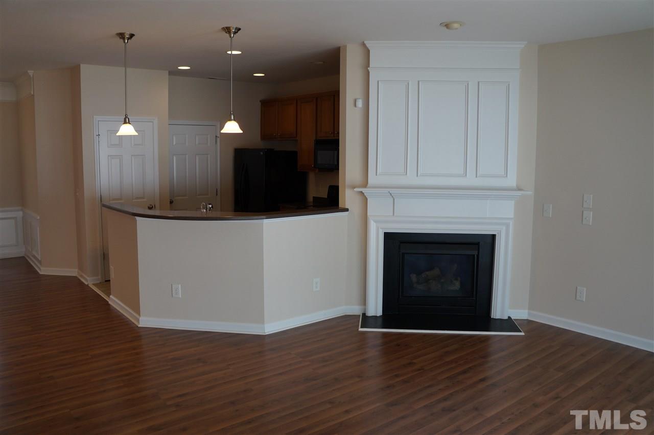 7036 Racine Way Raleigh, NC 27615 - Photo 3 of 22 a view of a livingroom with a fireplace