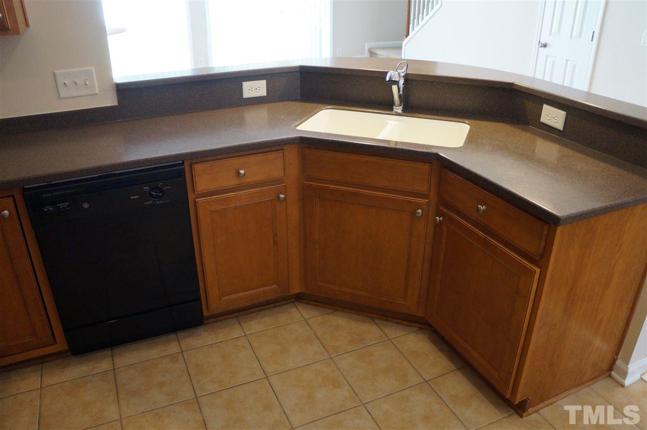 7036 Racine Way Raleigh, NC 27615 - Photo 8 of 22 a kitchen with a sink and cabinets