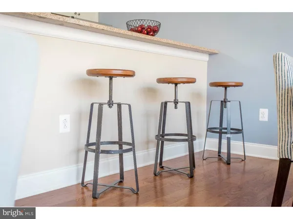 a kitchen with a sink and a dining table