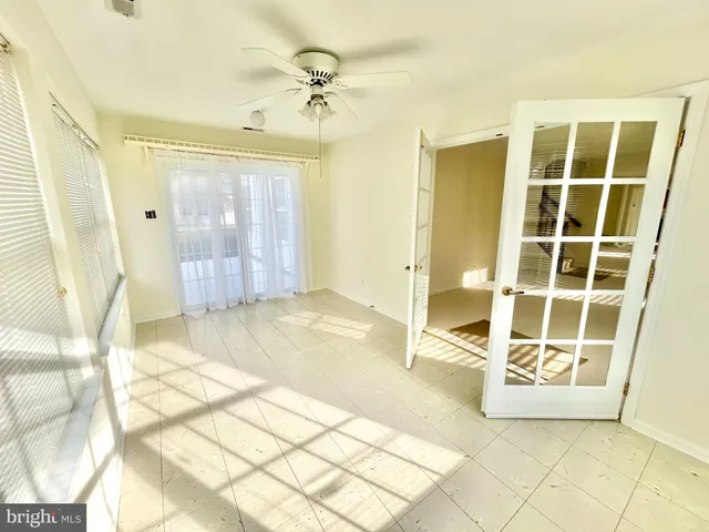 a view of an empty room with windows