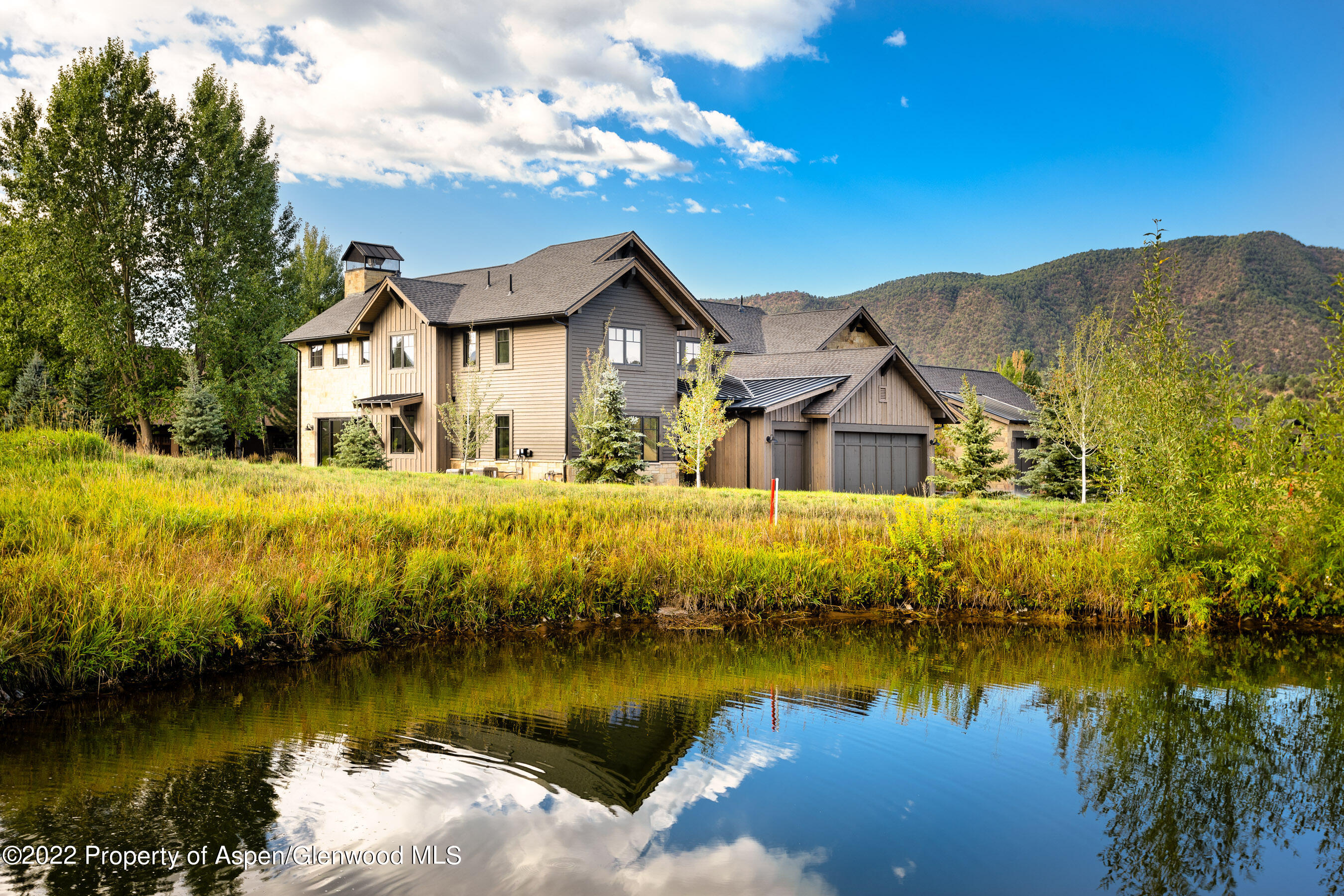 a view of a house with a lake view