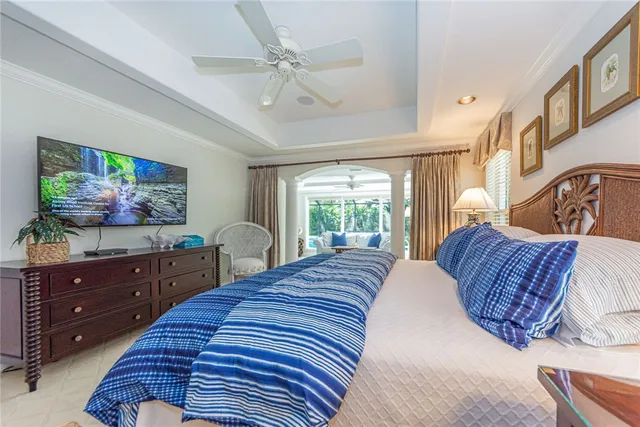 a bedroom with a bed dresser and window