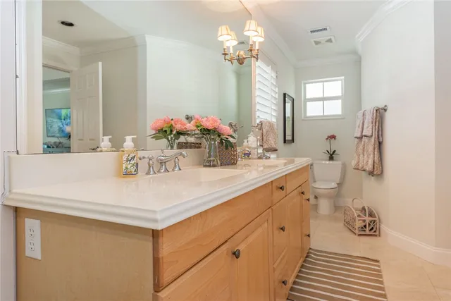 a bathroom with a sink vanity granite and a mirror