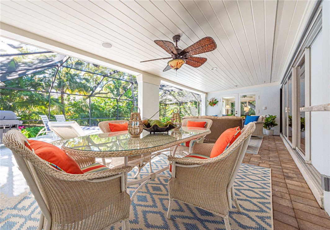 910 Seagrape Lane Vero Beach, FL 32963 - Photo 27 of 36 a living room with furniture and a large window