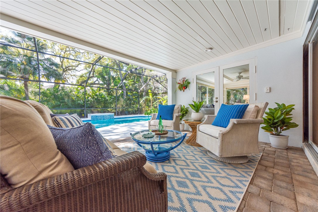 910 Seagrape Lane Vero Beach, FL 32963 - Photo 28 of 36 a living room with patio furniture and a potted plant