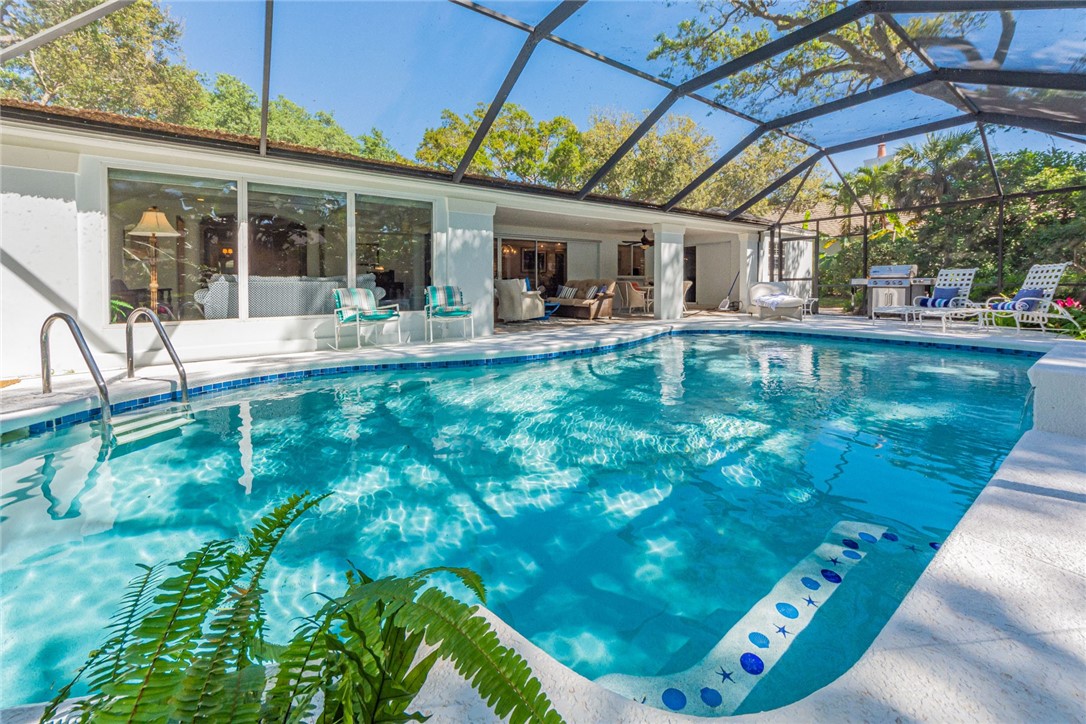 910 Seagrape Lane Vero Beach, FL 32963 - Photo 29 of 36 a view of a swimming pool with a patio