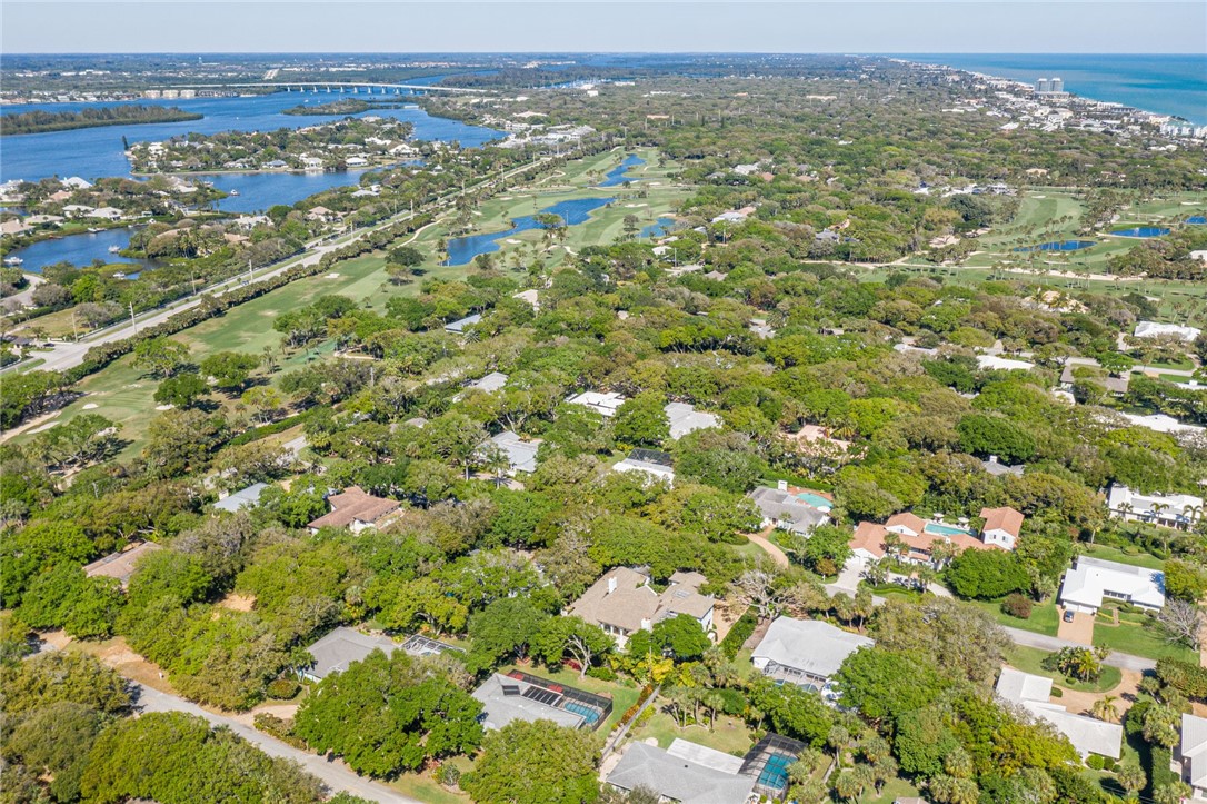 910 Seagrape Lane Vero Beach, FL 32963 - Photo 35 of 36 an aerial view of residential houses with outdoor space and trees