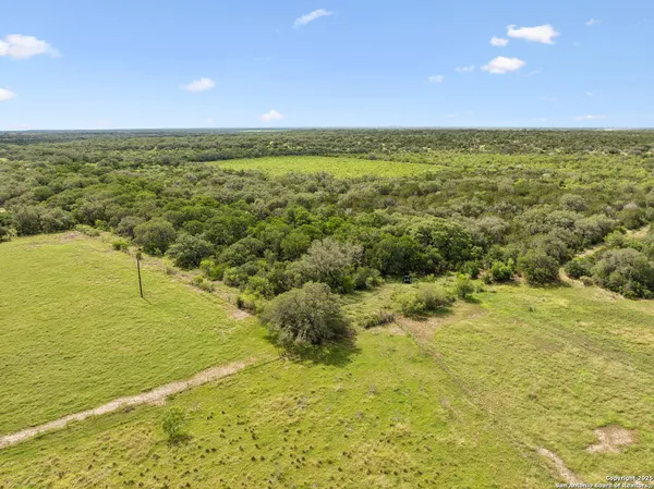 a view of an empty room and mountain view
