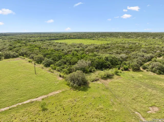 a view of an empty room and mountain view