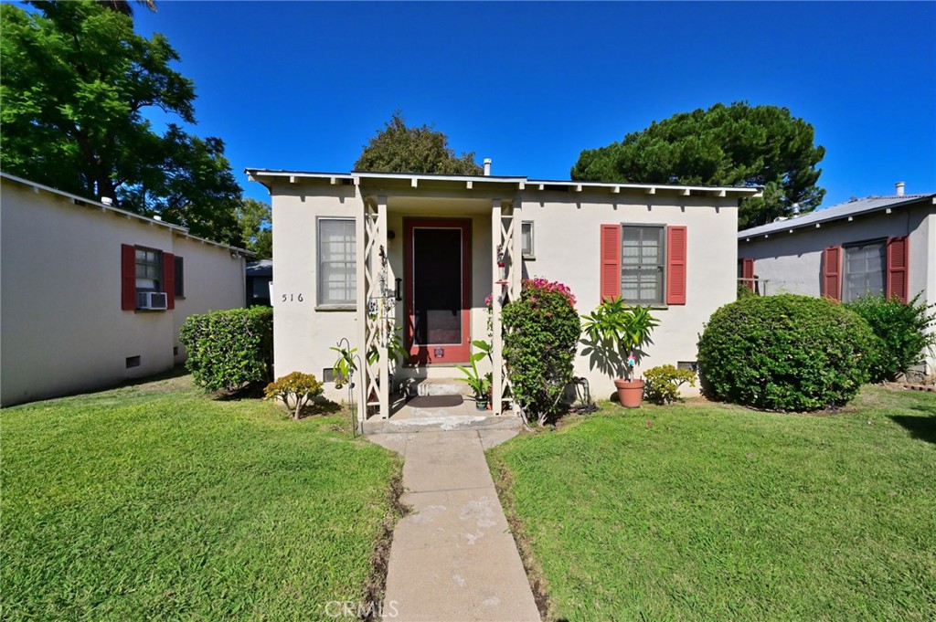 514 North Madison Avenue Pasadena, CA 91101 - Photo 12 of 29 a front view of a house with a yard
