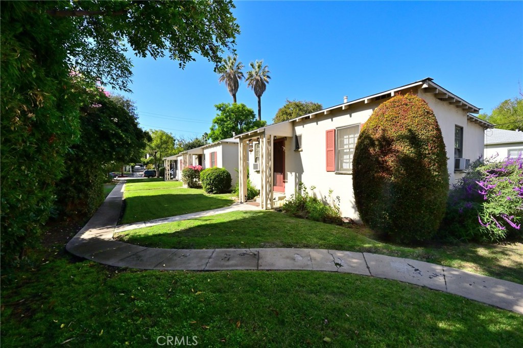 514 North Madison Avenue Pasadena, CA 91101 - Photo 16 of 29 a view of a house with a big yard and potted plants