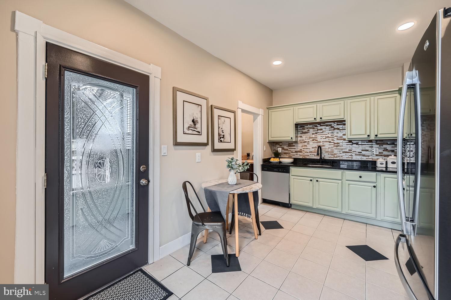 2415 Hammonds Ferry Road Halethorpe, MD 21227 - Photo 11 of 26 a kitchen with a sink cabinets and window