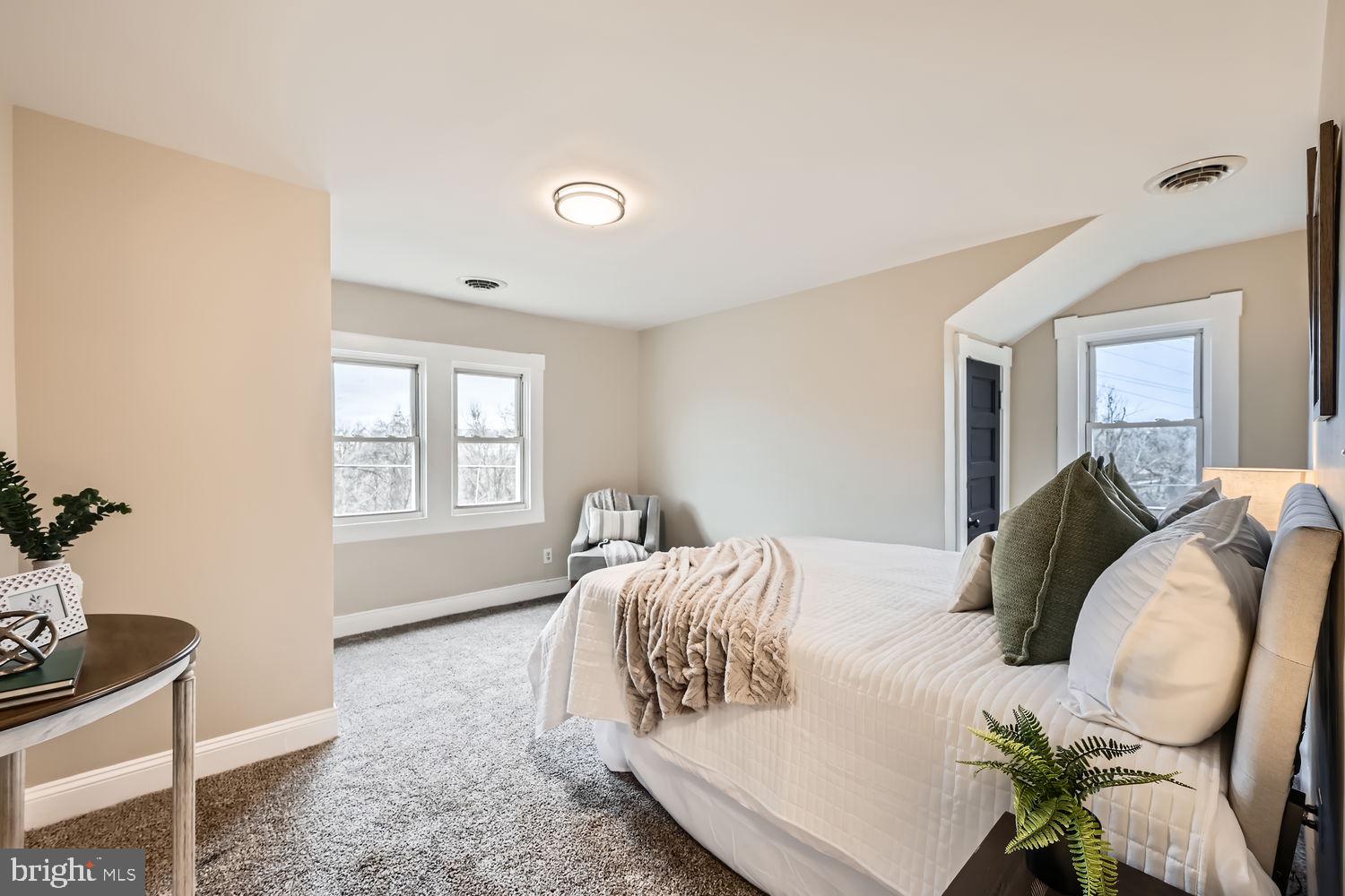 2415 Hammonds Ferry Road Halethorpe, MD 21227 - Photo 13 of 26 a bedroom with a bed and windows