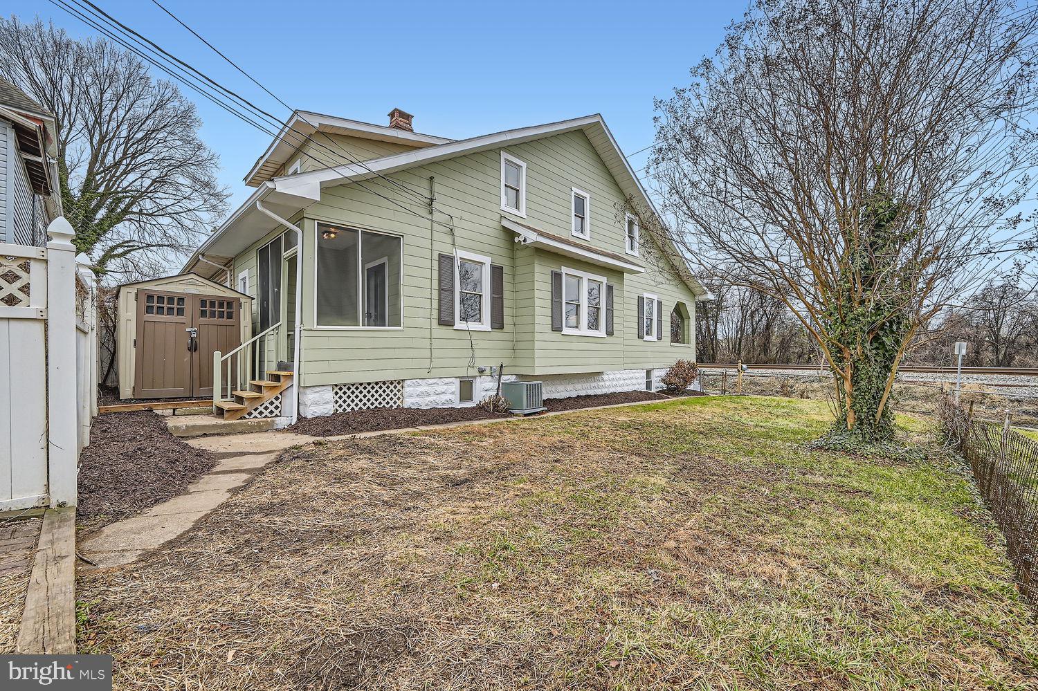 2415 Hammonds Ferry Road Halethorpe, MD 21227 - Photo 21 of 26 a front view of a house with a yard