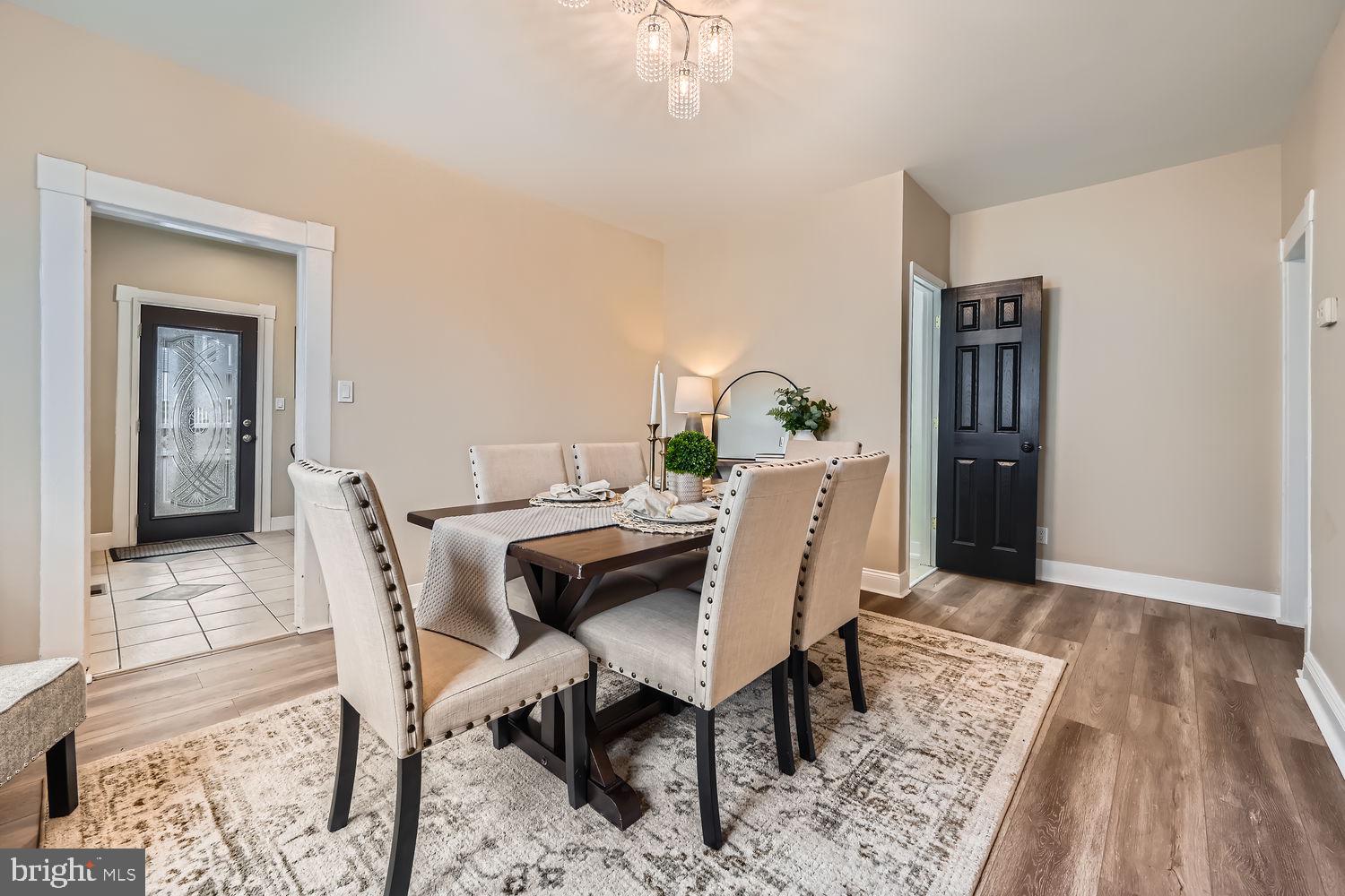 2415 Hammonds Ferry Road Halethorpe, MD 21227 - Photo 6 of 26 a view of a dining room with furniture and wooden floor
