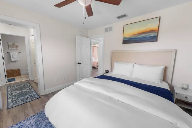 a bedroom with a bed and a rug