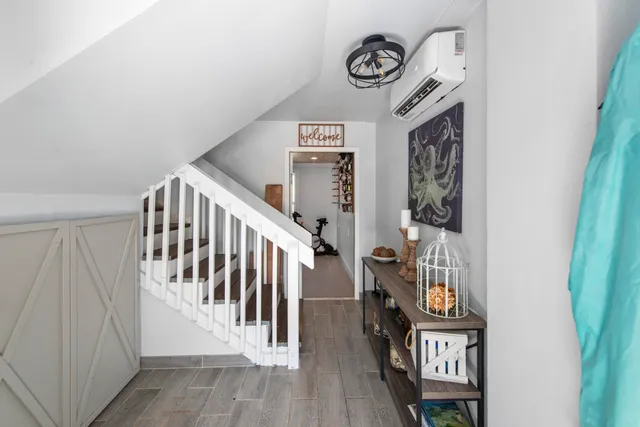 a view of entryway with stairs and furniture