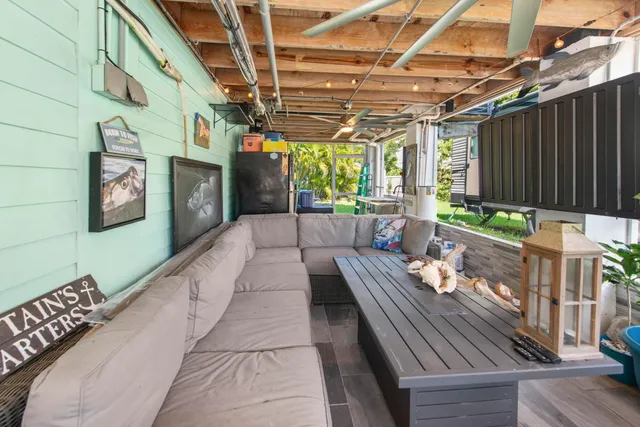 a outdoor space with lots of furniture and lots of potted plants