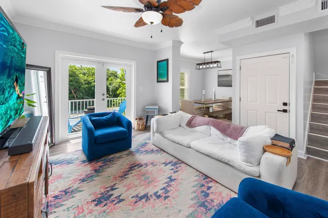 a living room with furniture rug and window